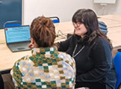Ella-May helping one of the participants at the workshop