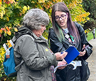 Two women looking at phones, 