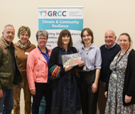 Photo of Flood Mary (centre) with volunteer flood wardens and GRCC staff and trustees