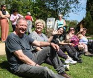 Batsford workshop participants sitting on a grassy bank