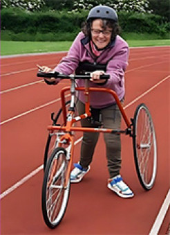Photo of a woman taking part in Frame Running on a running track