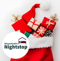 Image of Gloucester Nightstop logo and a Christmas stocking